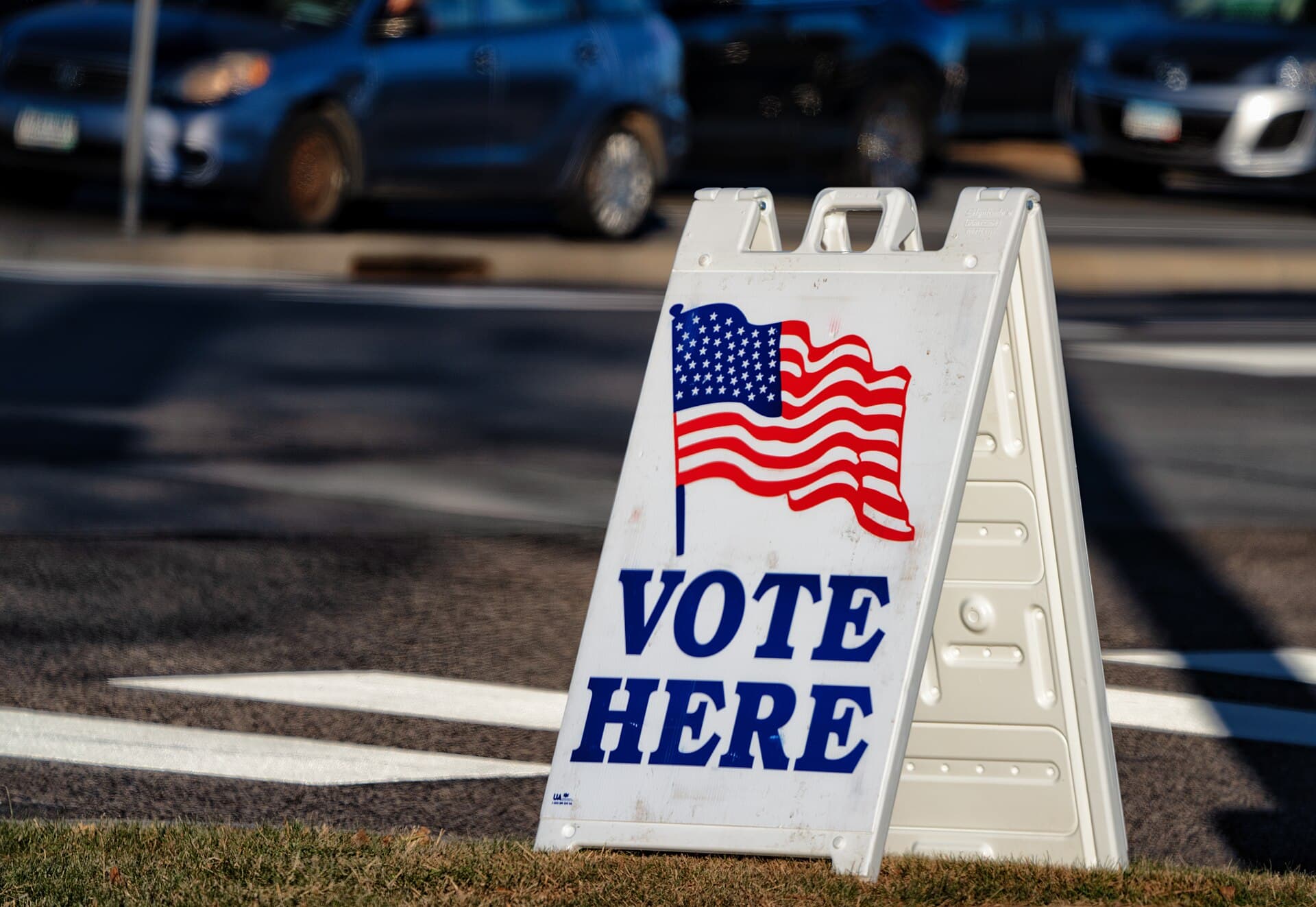 Vote Here sandwich board sign outside a polling place